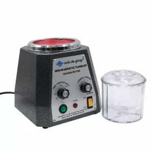 Magnetic Tumbler - used to polish and finish jewelry . It works by a rotating magnetic field to tumble small pins against the jewelry